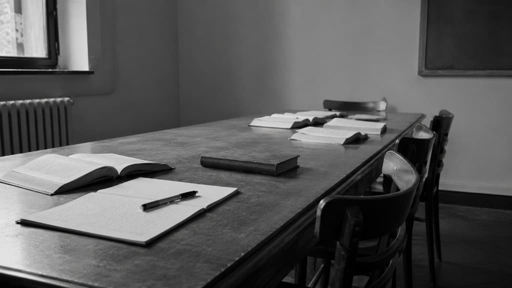 A reading room of manuscripts and bound volumes.