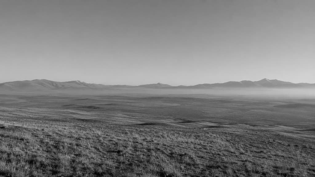 The high Anatolian plateau, low mountains and morning mist on the horizon.